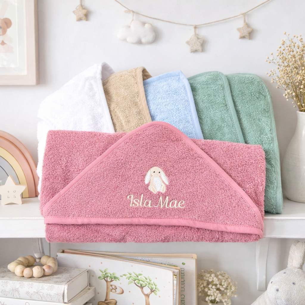 100% cotton hooded baby towels with an embroidered personalised name a cute bunny design