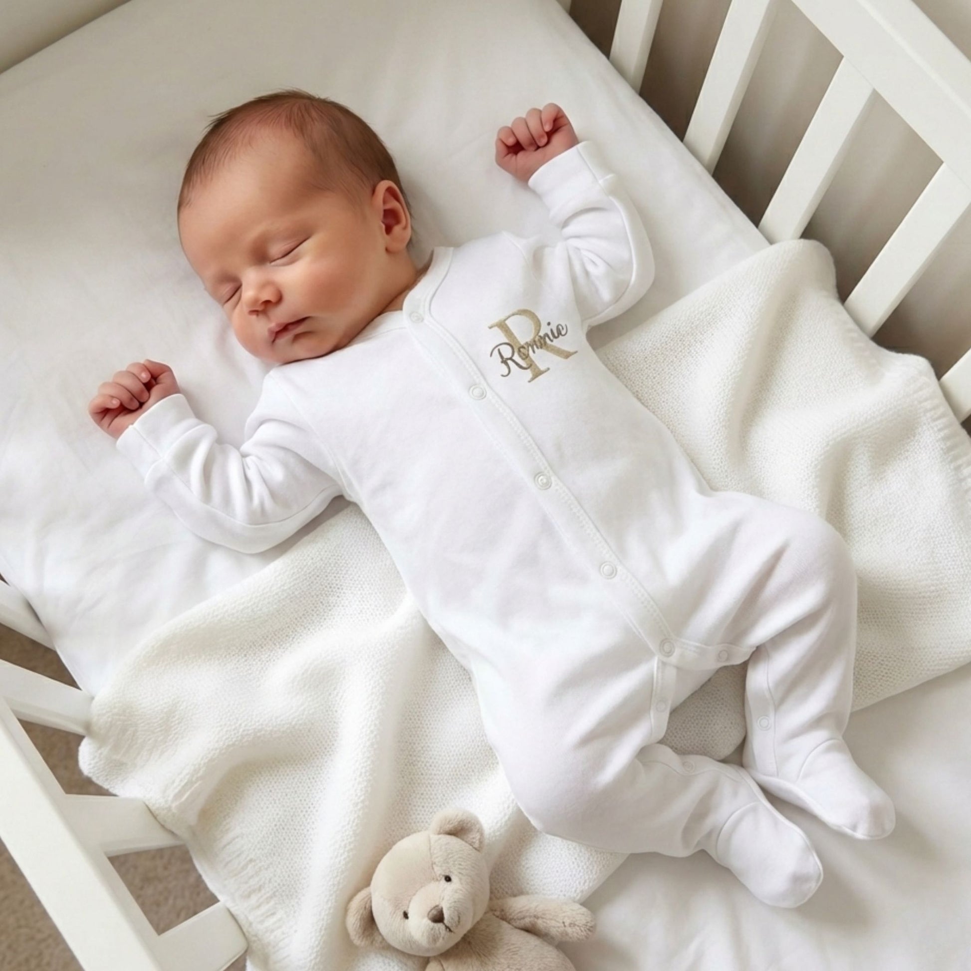 personalised baby sleepsuit in white with embroidered initials and name